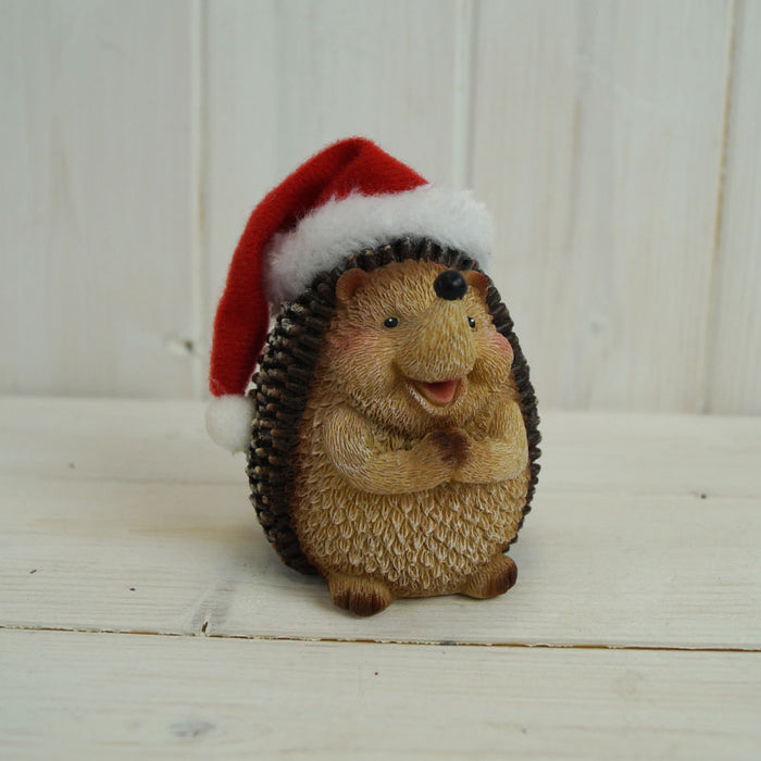 Clapping Hedgehog Wearing A Santa Hat